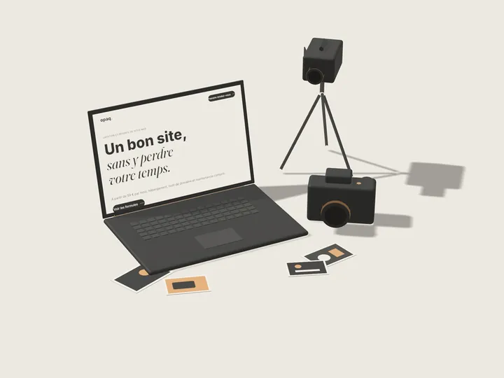 Un ordinateur portable, un appareil photo, une caméra sur trépied et quelques tirages photo.